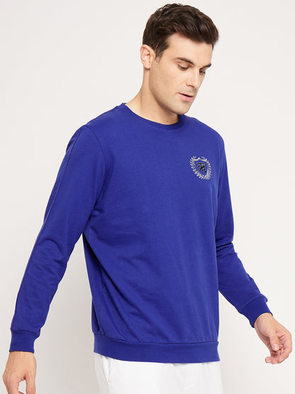Lively Blue Sweatshirt with Radiant Crest Design