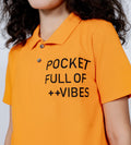 Polos Polo T-Shirt Vibrant Orange Polo T-Shirt with Positivity Graphic